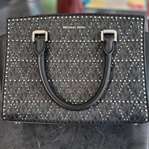 Micheal Kors studded Black handbag only been carried 2 times. Has shoulder strap